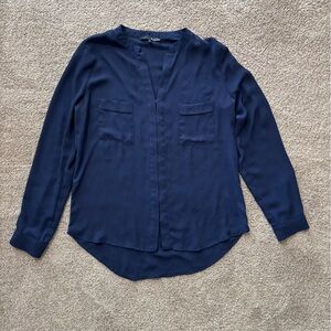 Navy blouse with front pocket detail. Size small.